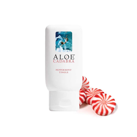 Aloe Cadabra product with peppermint candies on a white background