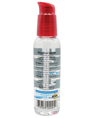 Bottle of silicone-based lubricant with a red cap on a white background