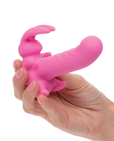 Compact rechargeable bunny vibrator for first-time users in hand for size reference