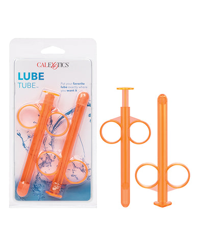 Two orange lube tubes next to two others in blue packaging.