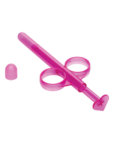 A pink lube tube angled away from the camera.