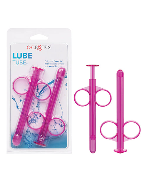 Two pink lube lubes next to two more lube tubes in blue packaging.