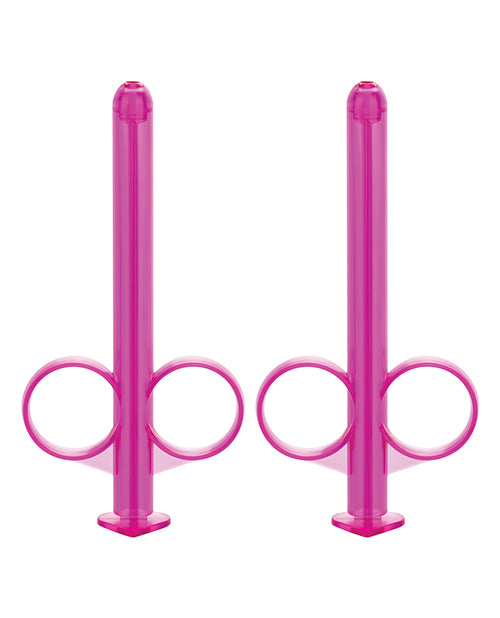 Two pink lube tubes facing up.