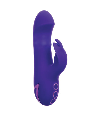 A purple silicone personal massager with a curved shaft and a small protruding arm ending, shown on a plain white background.