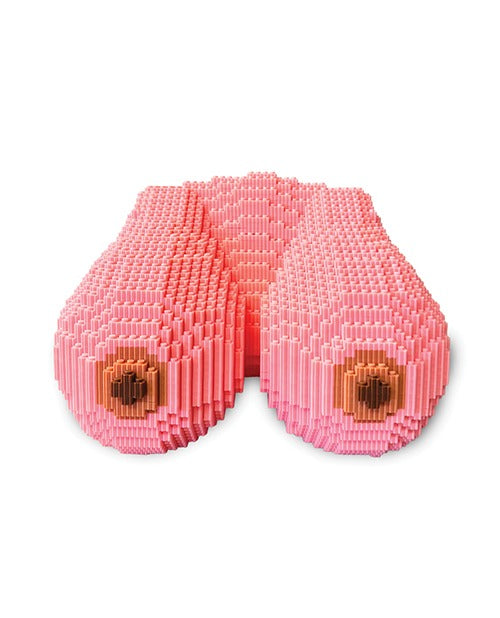 A LEGO-style bust made of blocks to form two breasts.
