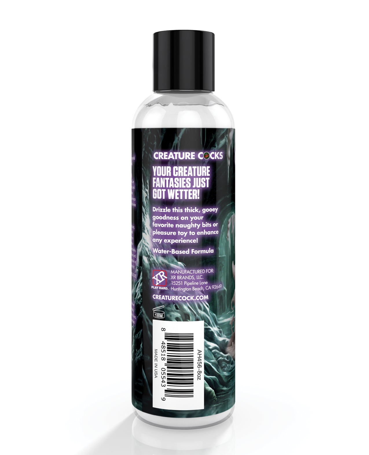 Bottle of 'Creature Cocks' product with label on a white background