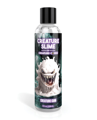 Bottle of 'Creature Slime' with a black cap and colorful label on a white background