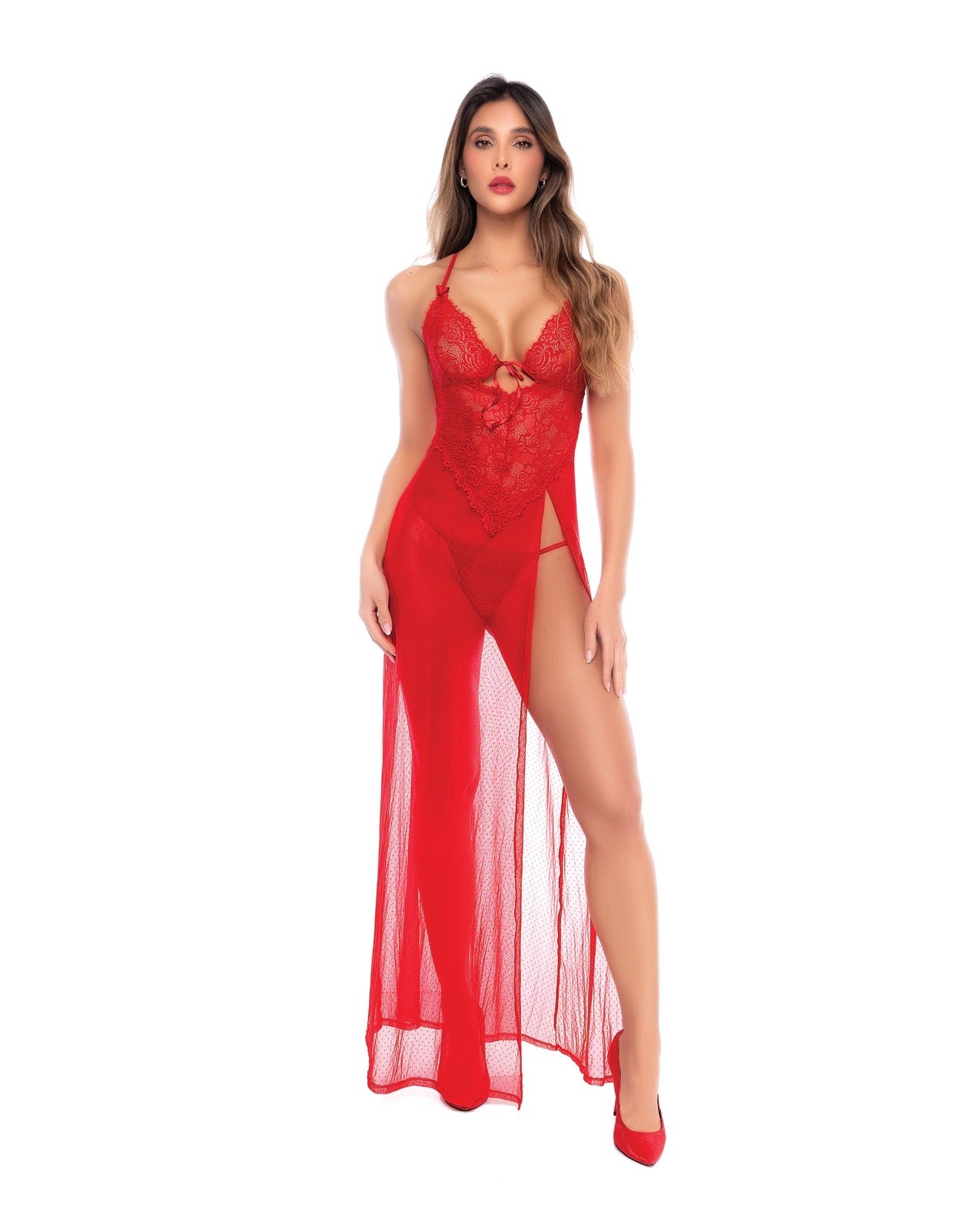 A woman modeling a red lace and sheer maxi lingerie dress with a thigh-high slit and keyhole front detail, shown against a plain white background.