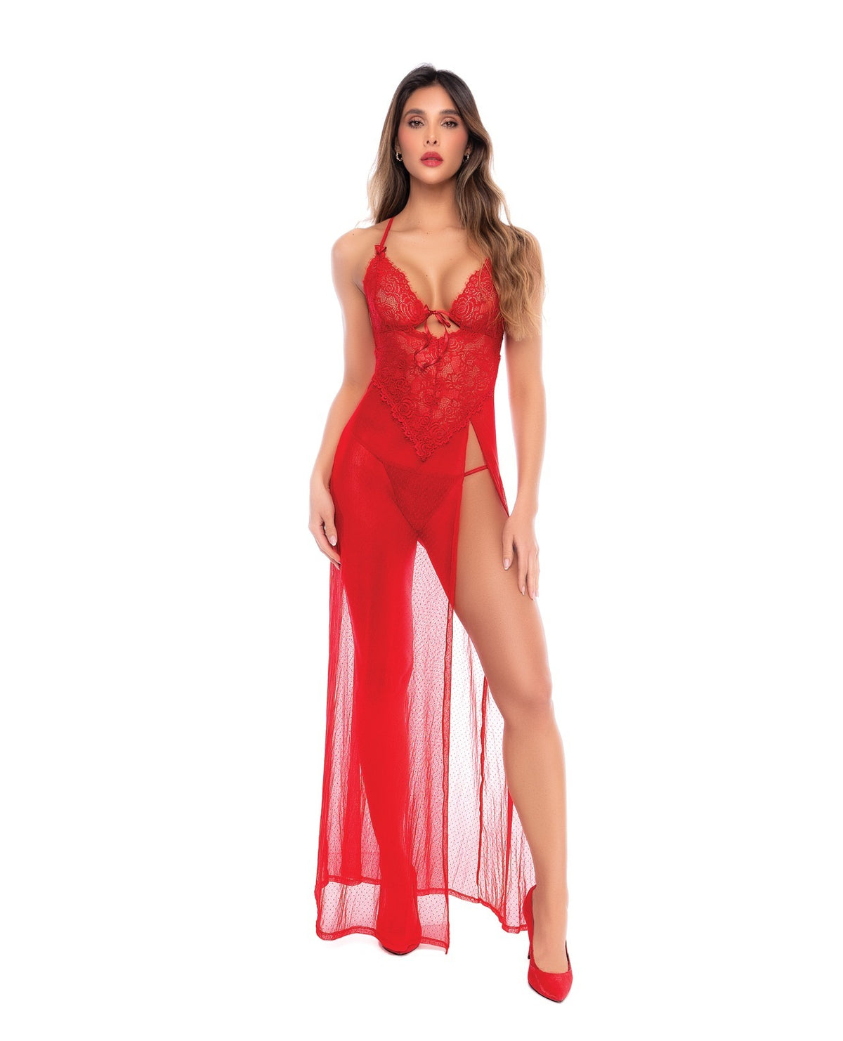 A woman modeling a red lace and sheer maxi lingerie dress with a thigh-high slit and keyhole front detail, shown against a plain white background.