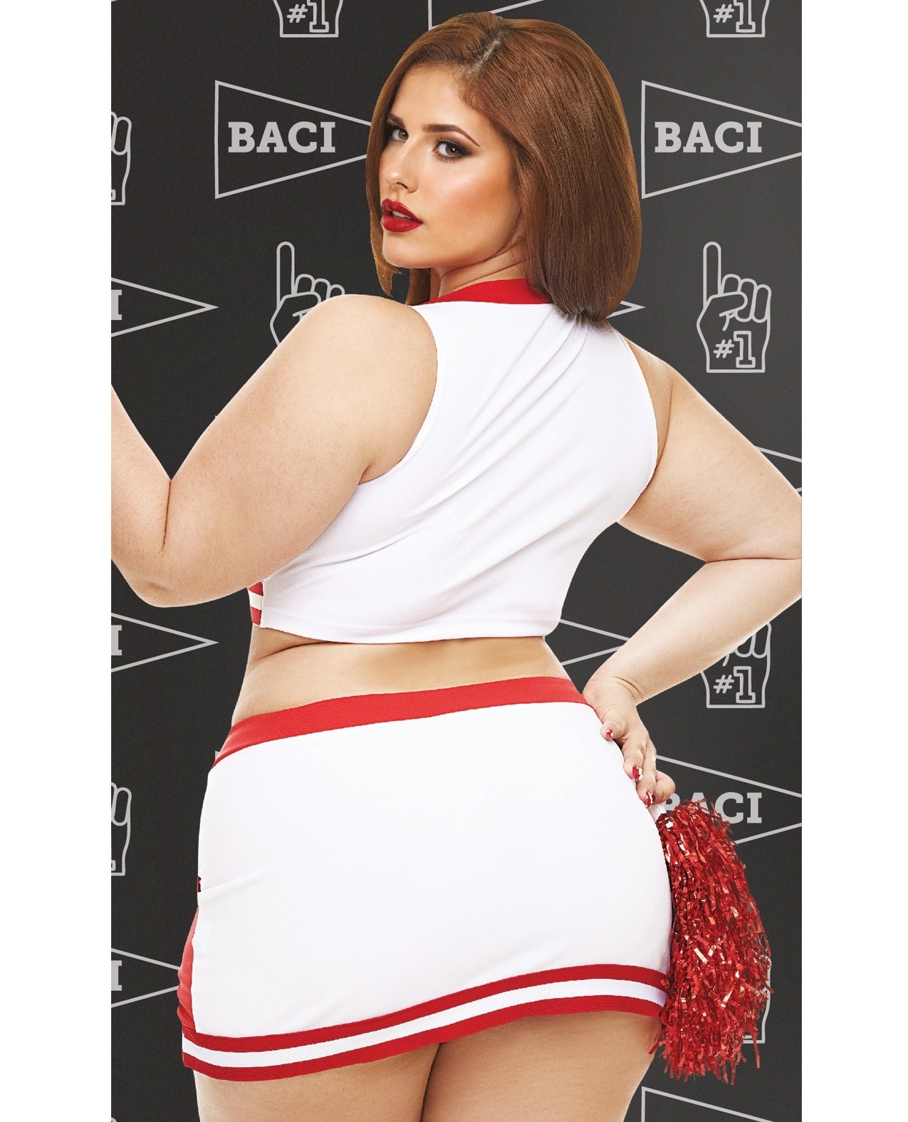 A woman modeling a white and red cheerleader-style crop top and mini skirt with a red pom-pom, standing against a dark patterned backdrop with the word BACI visible.