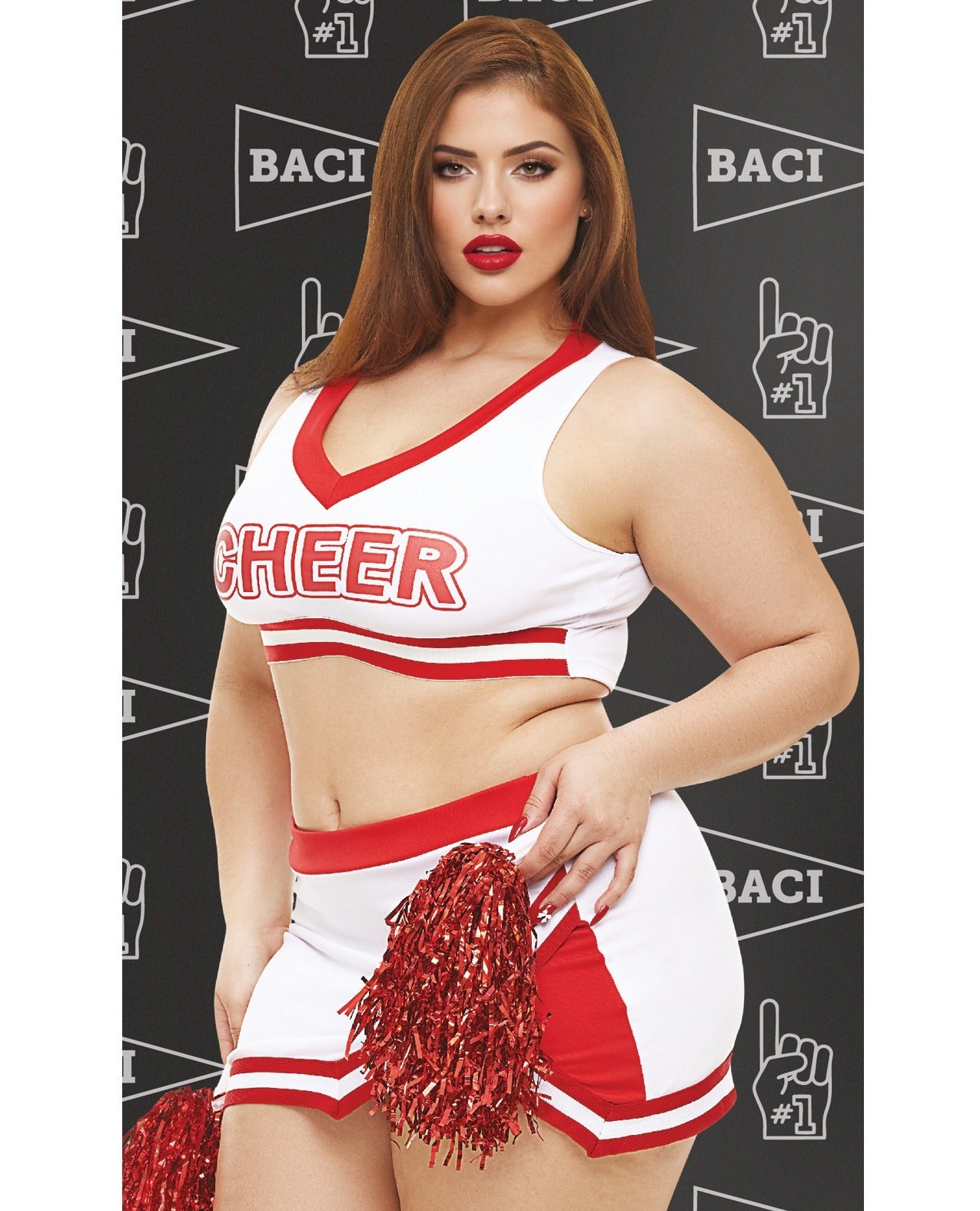 A woman modeling a white and red cheerleader costume set with red pom-poms, standing against a dark patterned backdrop with the word 'BACI' repeated.
