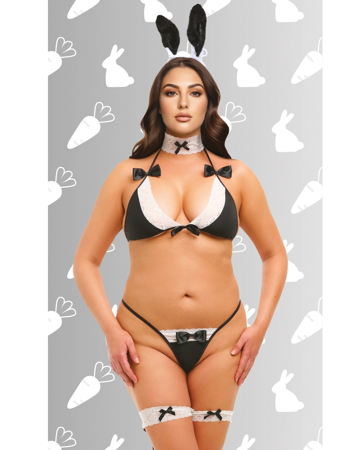 A woman modeling a black and white bunny-themed lingerie set with matching black bunny ears, a black bow choker, and thigh garters with bow details, set against a gray background with white bunny and carrot silhouettes.