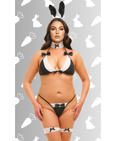 A woman modeling a black and white bunny-themed lingerie set with matching black bunny ears, a black bow choker, and thigh garters with bow details, set against a gray background with white bunny and carrot silhouettes.