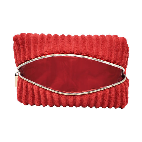 Red ribbed bag with a gold zipper on a white background