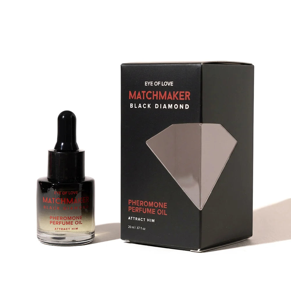 A bottle of Matchmaker Black Diamond Pheromone Perfume Oil next to its black packaging box with a diamond graphic, on a white background.