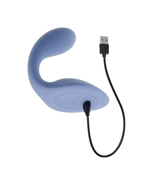 A light blue curved silicone personal massager with a built-in USB charging port and attached black USB cable, shown on a plain white background.