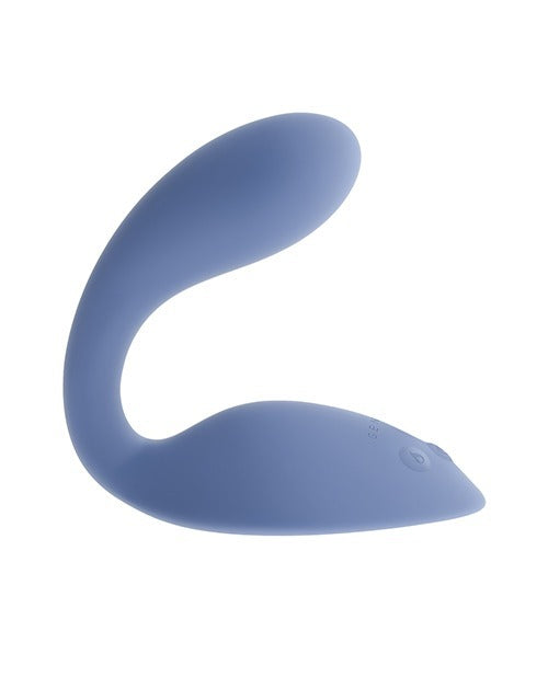 A light blue silicone personal massager with a curved shape, shown against a plain white background.