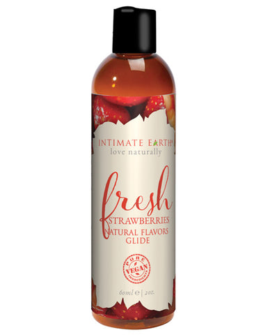 A bottle of Intimate Earth Fresh Strawberries Natural Flavor Glide - 2oz