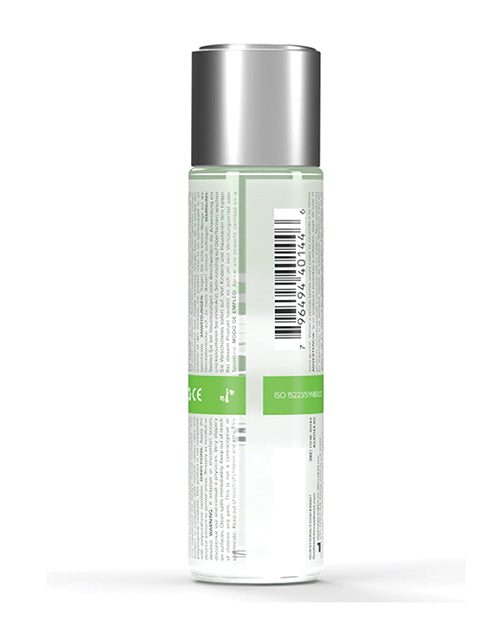 Tall cylindrical container with a silver top and green label on a white background