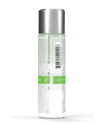 Tall cylindrical container with a silver top and green label on a white background