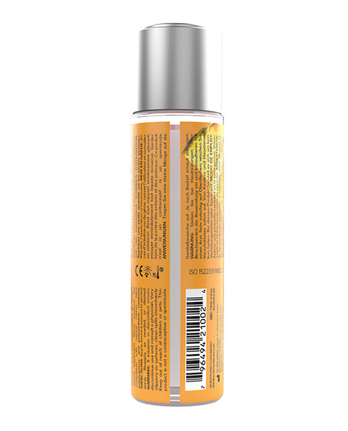 Bottle with orange label and silver cap on a white background