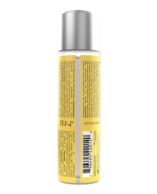Bottle with yellow label and silver cap on a white background