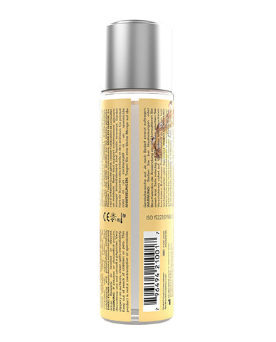 Bottle with a yellow label and silver cap on a white background