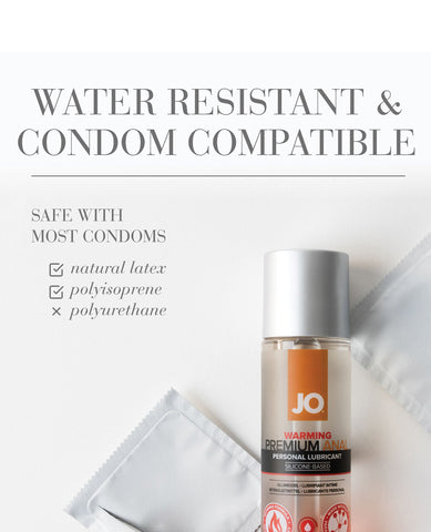 JO warming personal lubricant bottle with packaging on a white background with information about condom compatibility.