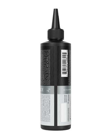 Black bottle with a label on a white background