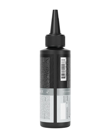 Black bottle with a label on a white background