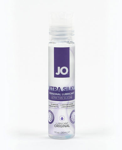 Bottle of JO Extra Silky personal lubricant on a white background