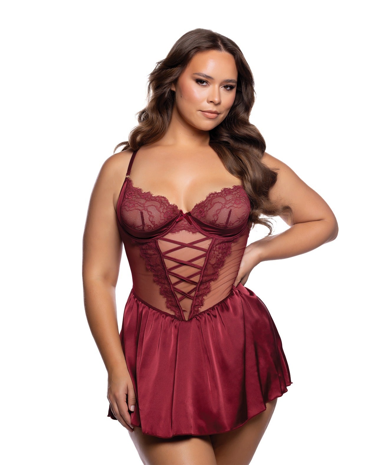 A woman modeling a burgundy lace and satin babydoll lingerie chemise against a plain white background.