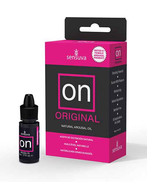 A pink and black box of ON Original Natural Arousal Oil featuring the black bottle next to it.