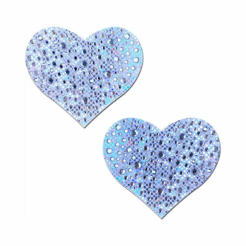 Two heart-shaped pasties with a glittery blue finish on a white background