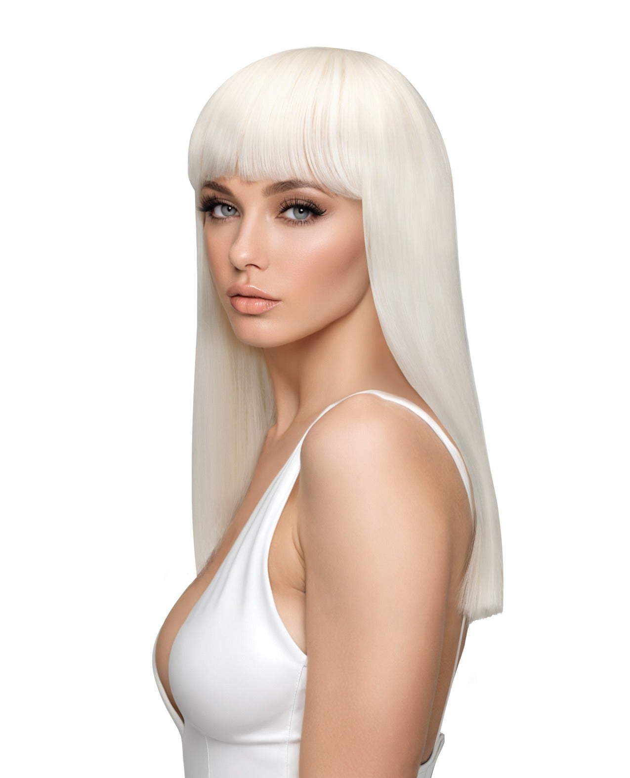 A woman with long, straight platinum-blonde hair and straight bangs, wearing a white camisole top against a solid white background.