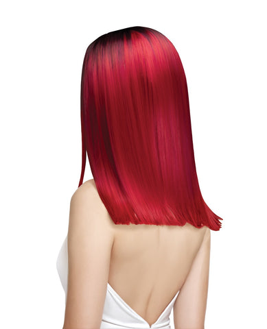 A person shown from the back wearing a bright red straight wig with dark roots, photographed against a plain white background.