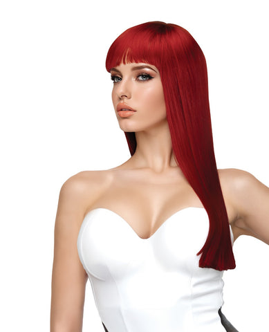 A woman modeling a bright red wig with straight bangs and long, sleek hair against a plain white background.