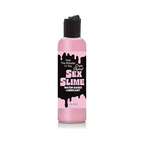 Pink and black bottle of Sex Slime lubricant on a white background
