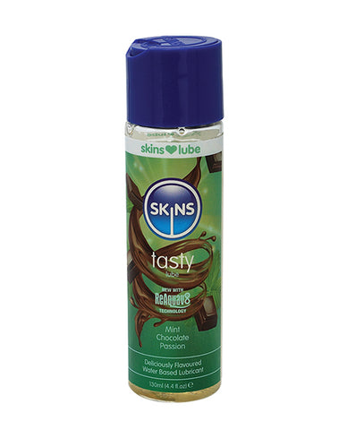 Skins lubricant bottle with blue cap and green label on a white background
