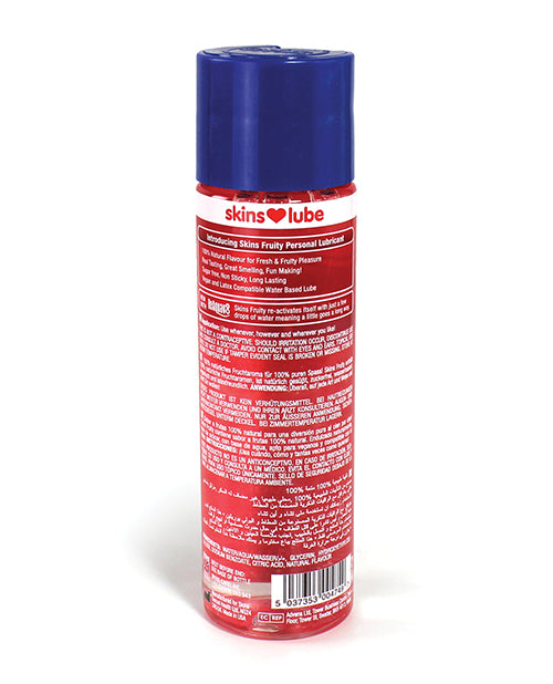Red and blue cylindrical container labeled 'skins lube' on a white background