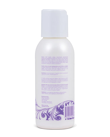 The back of a small bottle of Slippery Stuff Liquid. The bottle is pearlescent and has a purple swirly design at the bottom.