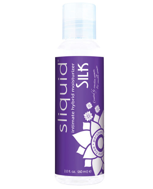 A bottle of Sliquid Silk. The liquid inside is a milky color and has a purple label with "Sliquid Silk" written on it.