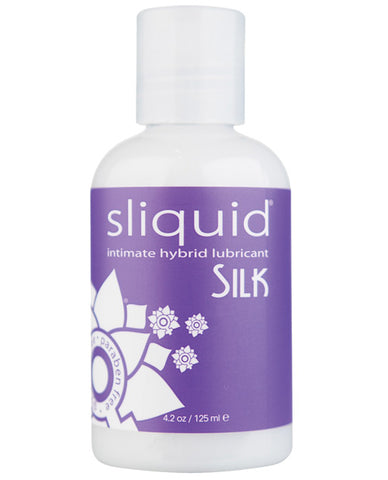 A bottle of Sliquid Silk. The liquid inside is a milky color and has a purple label with "Sliquid Silk" written on it.