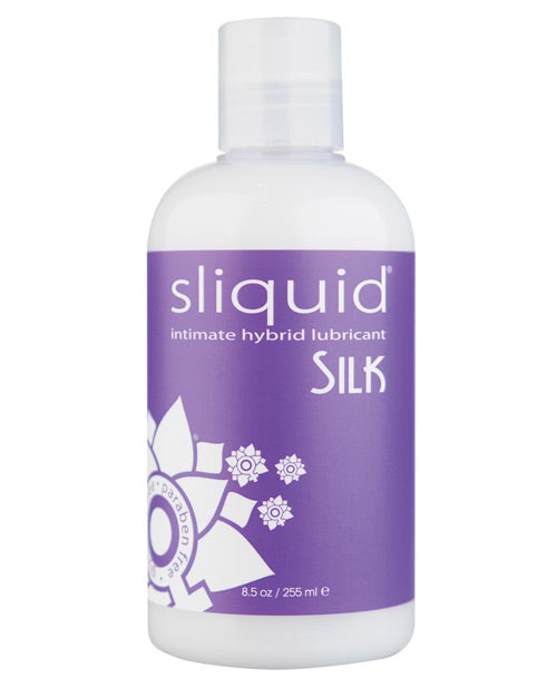A bottle of Sliquid Silk. The liquid inside is a milky color and has a purple label with "Sliquid Silk" written on it.