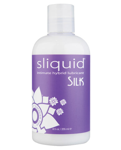 A bottle of Sliquid Silk. The liquid inside is a milky color and has a purple label with "Sliquid Silk" written on it.