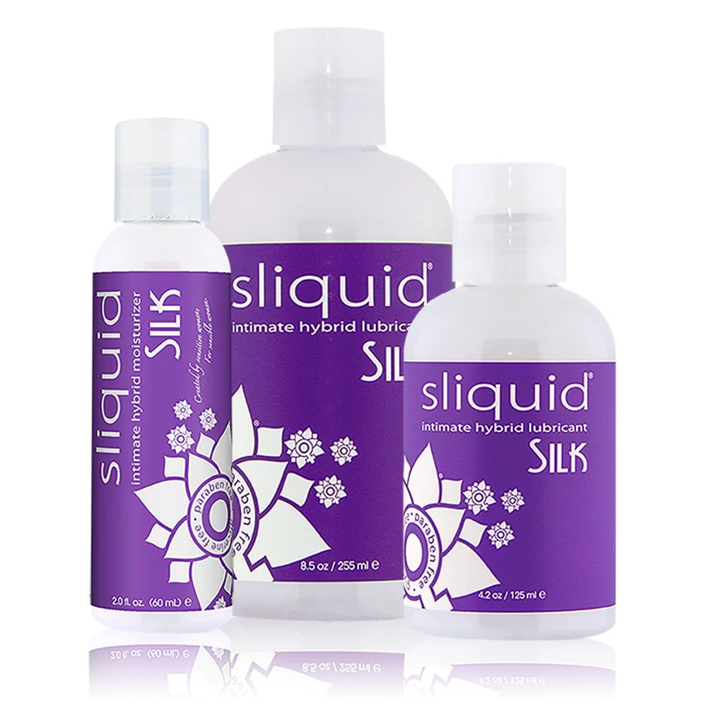 Three bottles of varying sizes of Sliquid Silk. They have a purple label with "Sliquid Silk" written on it.