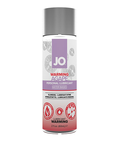 A bottle of System JO Warming Agape Lubricant. The label is purple at the top with the words "Personal Lubricant - Water-based" on it and red at the bottom with the words "warming lubricant."