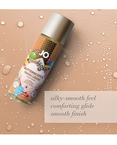 JO Candy Shop Butterscotch flavored lubricant bottle on a wet surface with product description text.