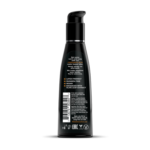 Black lubricant bottle with pump on a white background